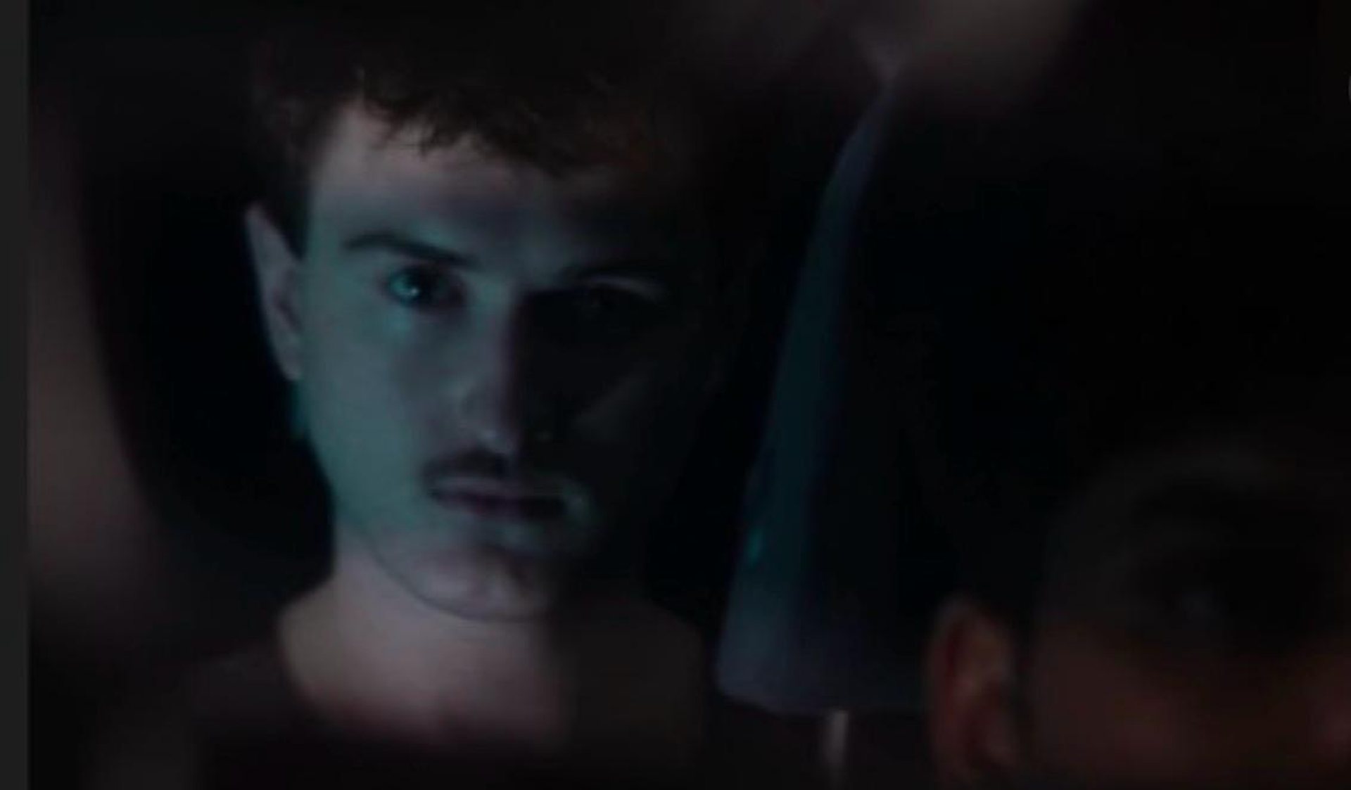Close-up of Andrei in low light